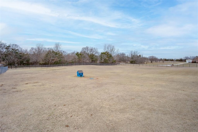 view of yard with a rural view