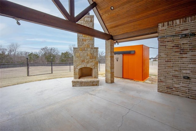 view of patio / terrace with an outdoor stone fireplace