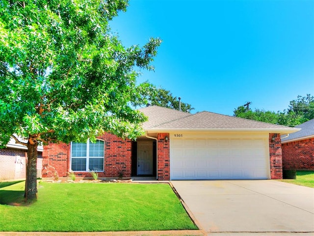 single story home with a garage and a front lawn