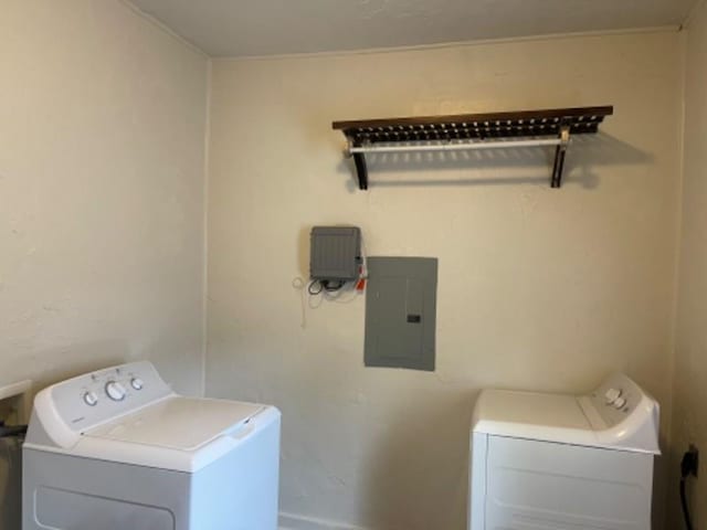 laundry area with washer and clothes dryer and electric panel