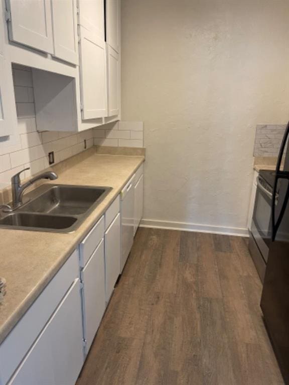 kitchen featuring sink, white cabinetry, tasteful backsplash, dark hardwood / wood-style floors, and dishwasher