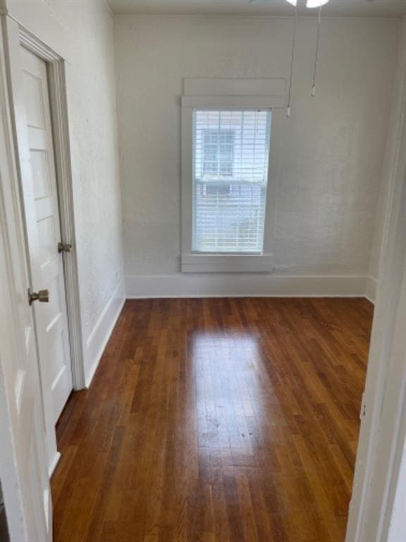 spare room featuring dark hardwood / wood-style flooring