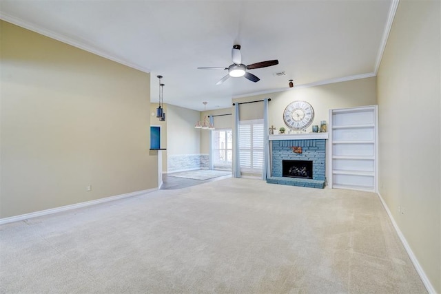 unfurnished living room with light carpet, a fireplace, ornamental molding, and ceiling fan