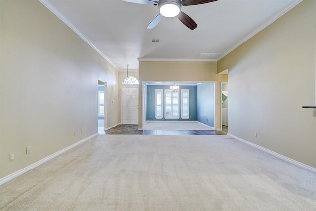 interior space featuring light carpet, ornamental molding, and ceiling fan