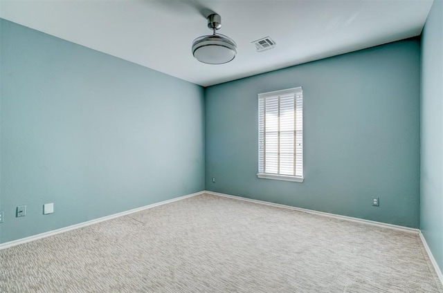 unfurnished room with carpet floors