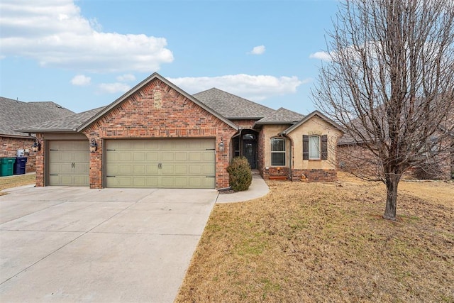 single story home with a garage and a front lawn