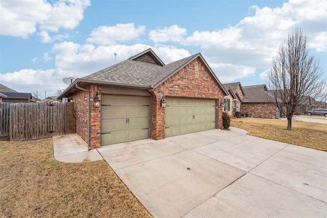 view of front of property with a garage and a front lawn