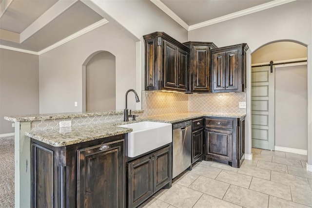 kitchen featuring sink, light stone countertops, kitchen peninsula, stainless steel dishwasher, and a barn door