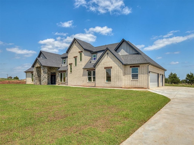 view of front of house with a garage and a front lawn