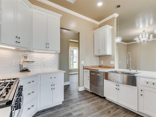 kitchen featuring pendant lighting, dishwasher, white cabinets, hardwood / wood-style flooring, and crown molding