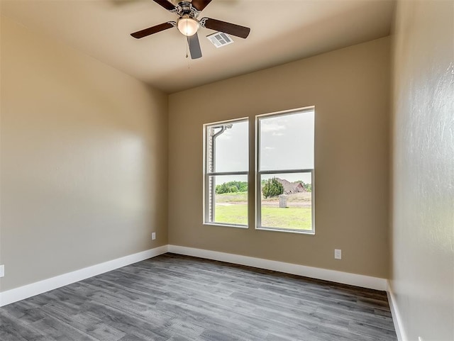 empty room featuring wood-type flooring and ceiling fan