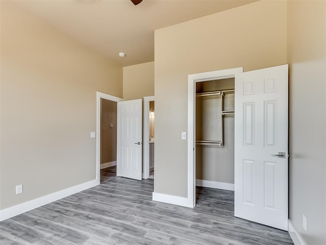 unfurnished bedroom featuring a closet and light hardwood / wood-style flooring