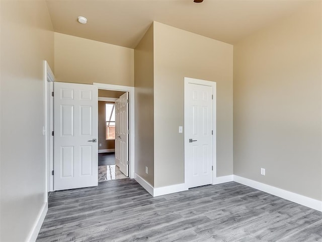 spare room with hardwood / wood-style floors