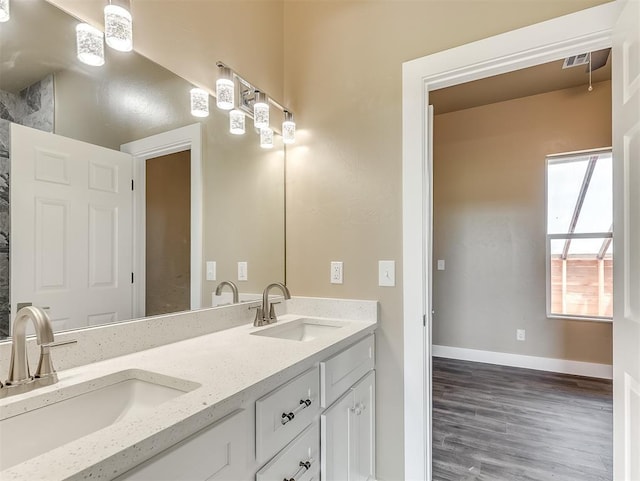 bathroom featuring vanity and wood-type flooring