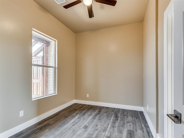 spare room featuring hardwood / wood-style flooring and ceiling fan