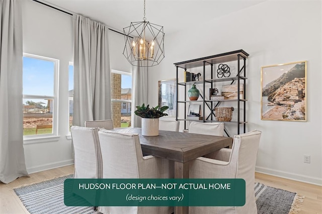 dining room with hardwood / wood-style flooring and a notable chandelier