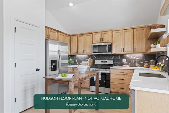 kitchen featuring sink, stainless steel appliances, light brown cabinetry, decorative backsplash, and vaulted ceiling