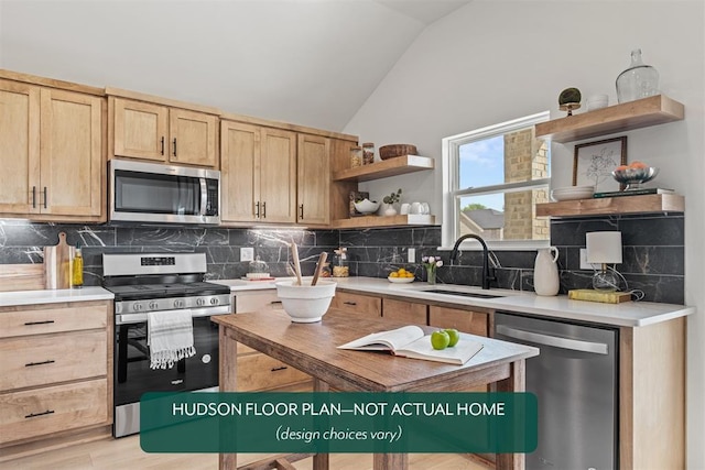 kitchen featuring light brown cabinetry, sink, vaulted ceiling, stainless steel appliances, and decorative backsplash