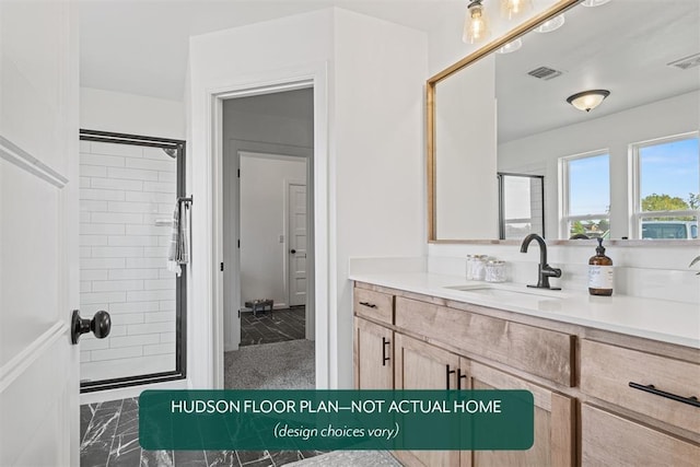 bathroom with vanity and a shower with door