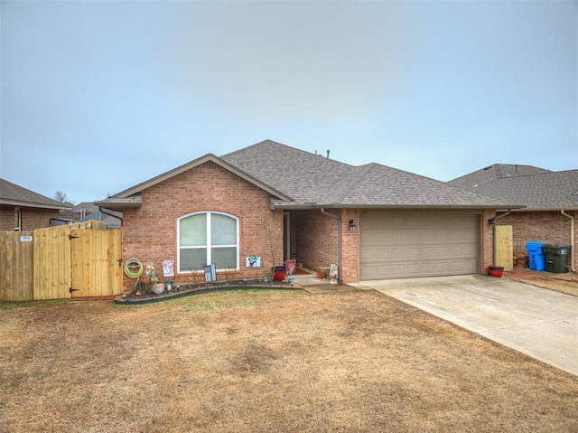 single story home with a garage and a front yard