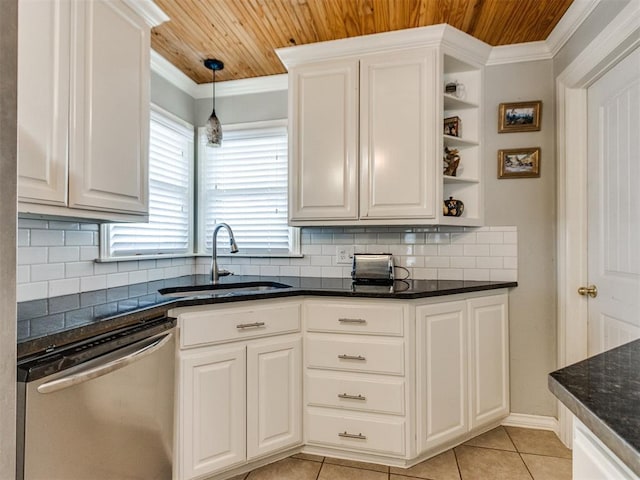 kitchen with white cabinetry, stainless steel dishwasher, crown molding, and sink