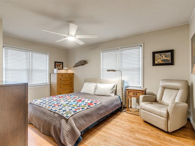 bedroom featuring ceiling fan and light hardwood / wood-style flooring