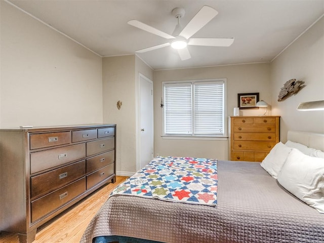 bedroom featuring light hardwood / wood-style floors and ceiling fan