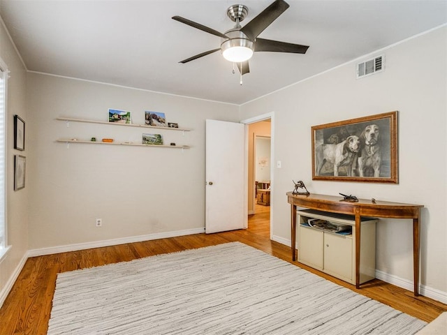 interior space featuring ceiling fan and light hardwood / wood-style floors