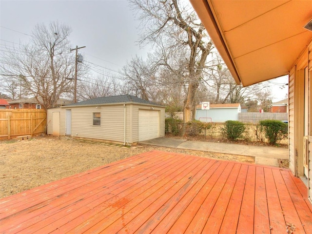 deck featuring a garage and an outbuilding