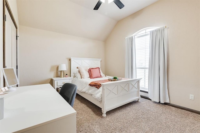 bedroom featuring lofted ceiling, light colored carpet, and ceiling fan