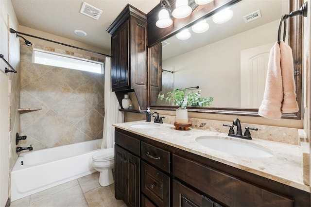 full bathroom with vanity, tile patterned floors, toilet, and shower / bath combo with shower curtain