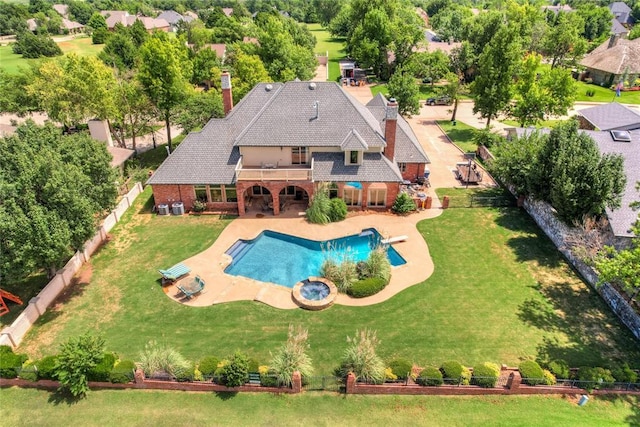 view of swimming pool featuring a patio area and a lawn