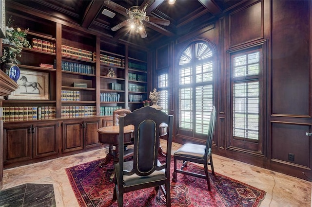 office area featuring built in shelves, coffered ceiling, ornamental molding, ceiling fan, and beam ceiling