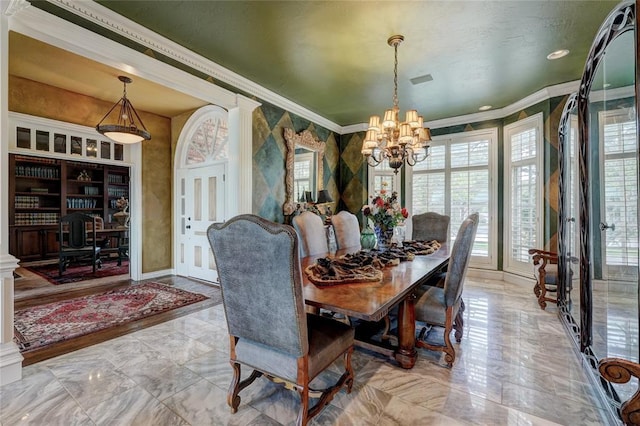 dining room with an inviting chandelier and crown molding