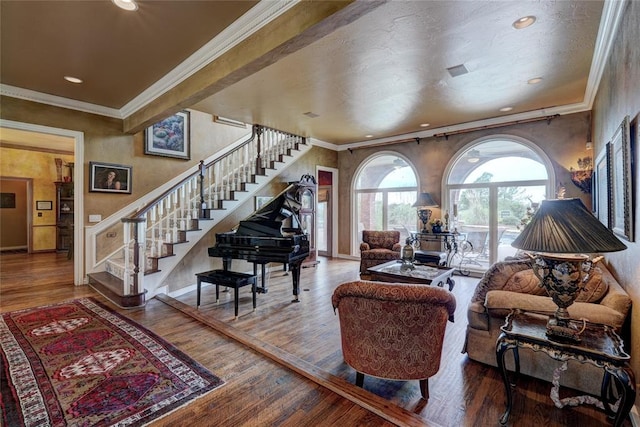 living room with hardwood / wood-style floors and ornamental molding