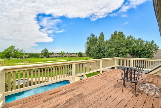 deck featuring a lawn