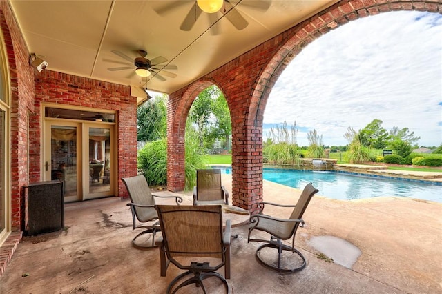 view of patio / terrace with pool water feature and ceiling fan