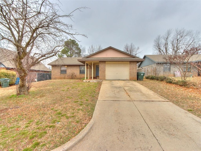 ranch-style home with a garage and a front yard