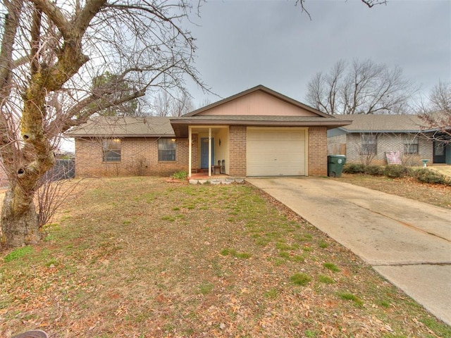 ranch-style house featuring a garage and a front yard