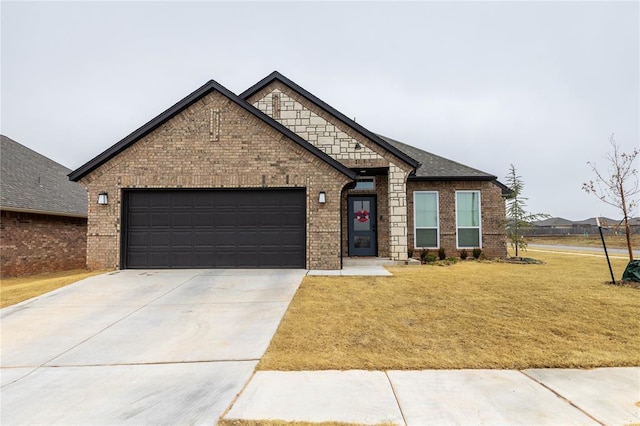 view of front facade with a garage and a front yard