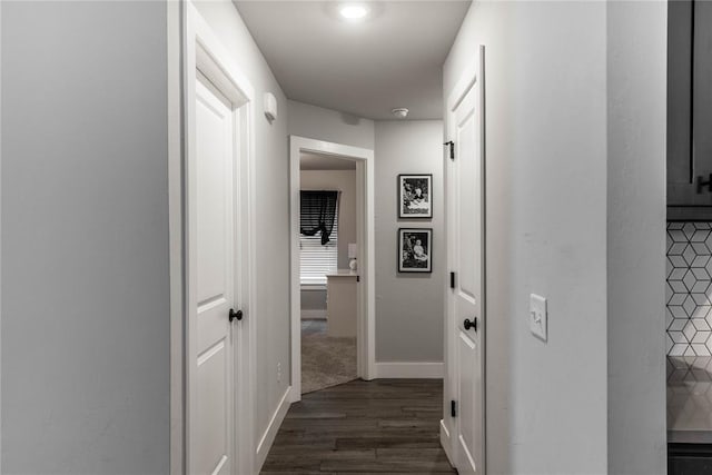 hall featuring dark wood-type flooring