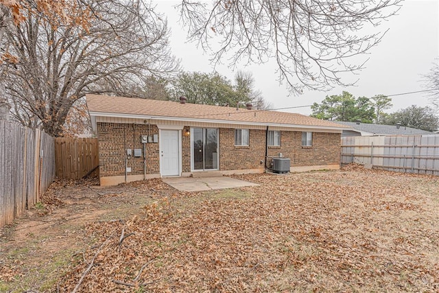 back of property featuring central AC and a patio area