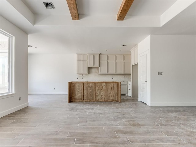 101 W 3rd St, Arcadia, OK 73007 - kitchen featuring open floor plan, a center island, light wood-type flooring, and beamed ceiling