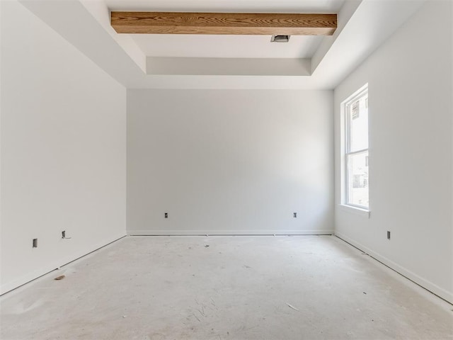 101 W 3rd St, Arcadia, OK 73007 - unfurnished room featuring a tray ceiling, unfinished concrete flooring, and baseboards