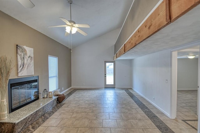 unfurnished living room with lofted ceiling, light tile patterned floors, and ceiling fan