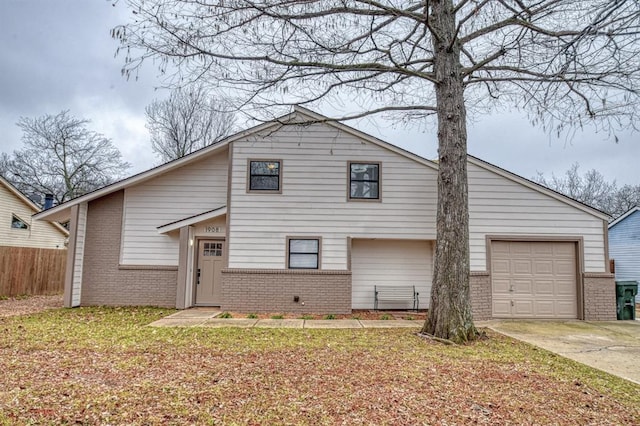 view of front of home featuring a garage and a front yard