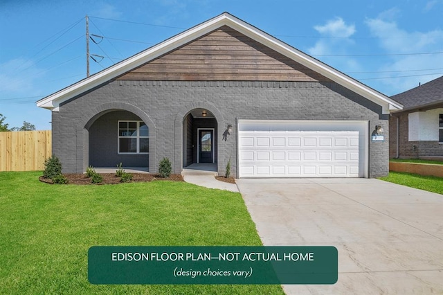 view of front of home featuring a garage and a front yard