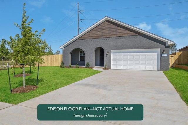 view of front of property featuring a garage and a front yard