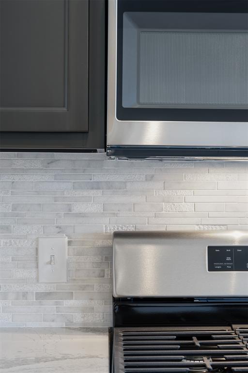 3400 Piney River Dr, Yukon, OK 73099 - details featuring light countertops and appliances with stainless steel finishes