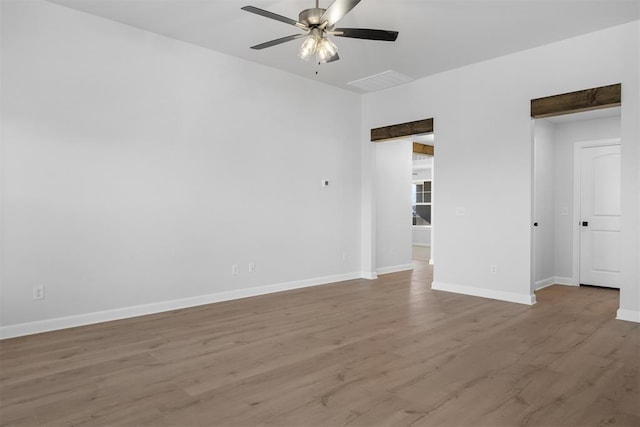 3400 Piney River Dr, Yukon, OK 73099 - empty room with ceiling fan, baseboards, and wood finished floors